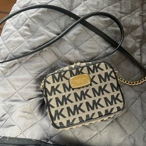 Michael Kors Mini Purse in good condition. No stains. Used once. Shoulder strap.